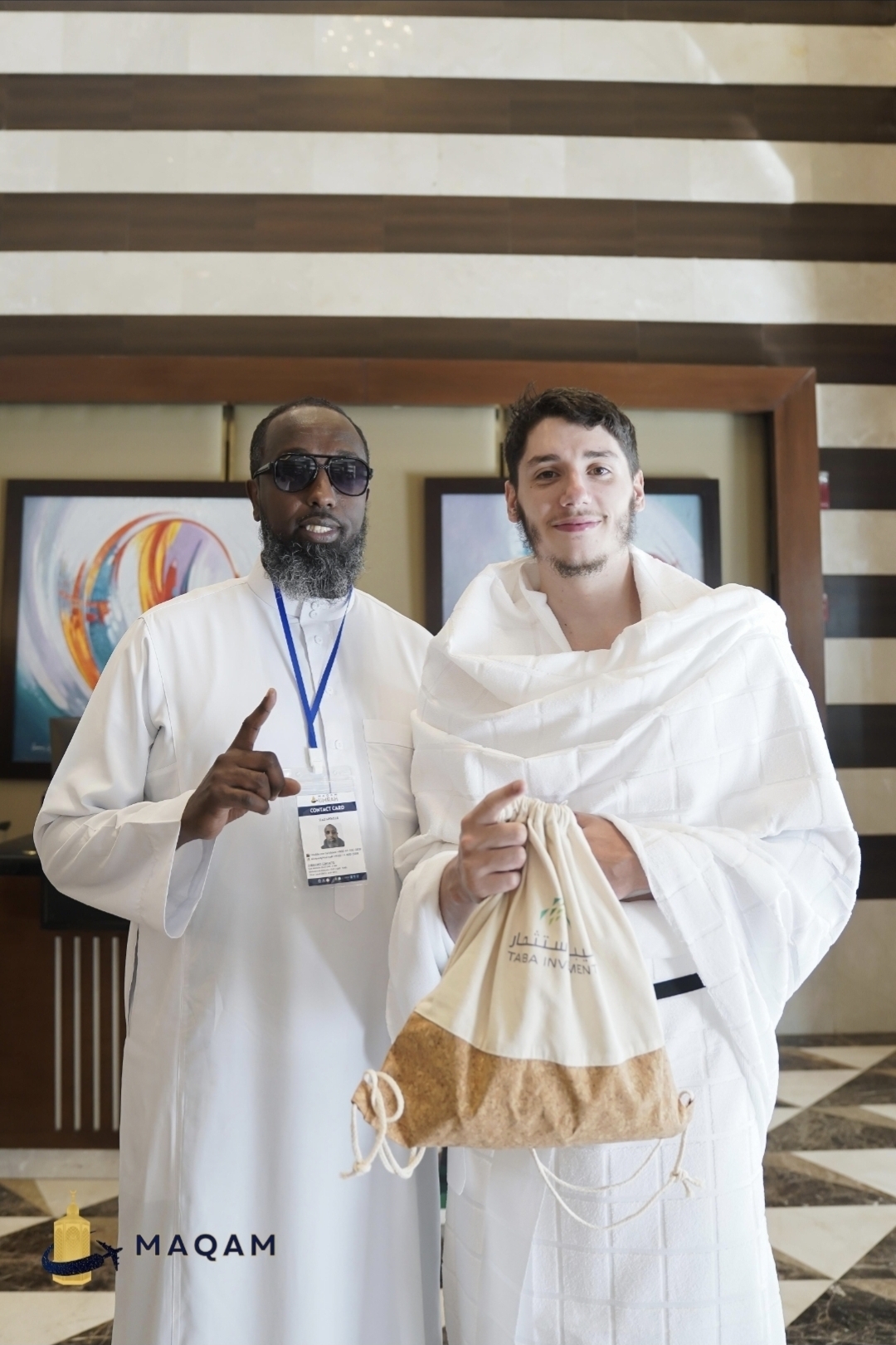 Aiden in ihram with New Muslim Umrah (NMU) staff before his first Umrah